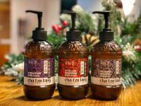 three bottles of chili jam on a table with christmas trees at Art&#39;otel Ximending Taipei in Taipei