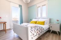 A bed or beds in a room at Kyma seaview Apartments, Episkopi beach Rethymno