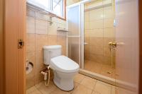 a bathroom with a toilet and a shower at Li Jin Kuan Homestay in Nanzhuang