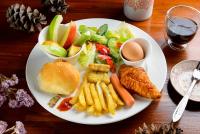 a white plate of food with a sandwich and a salad at Li Jin Kuan Homestay in Nanzhuang