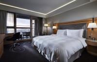 a hotel room with a large bed and a window at K Hotel Taipei Songjiang in Taipei