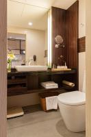 a bathroom with a sink and a toilet at Pacific Business Hotel in Taipei