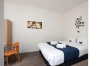 Postel nebo postele na pokoji v ubytování Kings Inn City Hostel