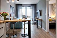 Televízia a/alebo spoločenská miestnosť v ubytovaní P&O Corporate Serviced Apartments Cybernetyki