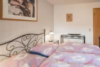 Postel nebo postele na pokoji v ubytování Familienwohnung Haus 18