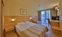 A bed or beds in a room at Flamingo Hotel 4*