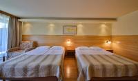 A bed or beds in a room at Flamingo Hotel 4*