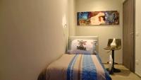 A bed or beds in a room at Blue Moon - Via Parigi Apartments