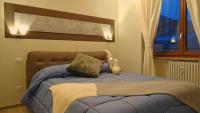 A bed or beds in a room at Blue Moon - Via Parigi Apartments