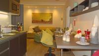 A kitchen or kitchenette at Blue Moon - Via Parigi Apartments