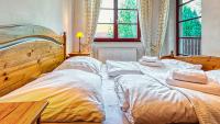 Posteľ alebo postele v izbe v ubytovaní Apartament Klimat Górski na Okrzei - 5D Apartamenty