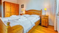 Posteľ alebo postele v izbe v ubytovaní Apartament Klimat Górski na Okrzei - 5D Apartamenty