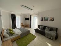 Posteľ alebo postele v izbe v ubytovaní Apartamenty Zielony Ogród