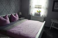 Postel nebo postele na pokoji v ubytování Ferienwohnung-An-der-Koppel