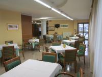 a dining room with white tables and chairs at Hotel Due Pini in Melfi
