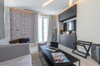 Le Dortoir Boutique Suitesにあるテレビまたはエンターテインメントセンター