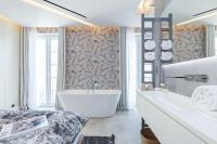 Le Dortoir Boutique Suitesにあるベッド