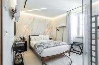 Le Dortoir Boutique Suitesにあるベッド
