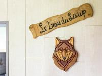 a sign on the wall of a bathroom with a dog head at Perfect spot on the edge of a large wood in Awenne