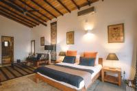 a bedroom with a large bed in a room at Highland Villa in Weligama