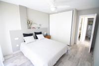 A bed or beds in a room at Apartamento Mediterraneo