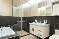 a bathroom with a sink and a glass shower at Miller Home in Yuchi