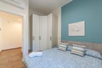 Łóżko lub łóżka w pokoju w obiekcie Prima dell'Elba Family Apartments