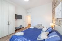 Łóżko lub łóżka w pokoju w obiekcie Prima dell'Elba Family Apartments