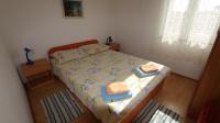 Łóżko lub łóżka w pokoju w obiekcie Apartments Ravlic
