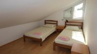 Łóżko lub łóżka w pokoju w obiekcie Apartments Ravlic
