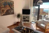Televízia a/alebo spoločenská miestnosť v ubytovaní NATURAL DREAM APARTMENT BLUE WIFI