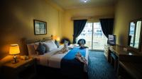 Green House Hotel Suites & Apartmentにあるベッド