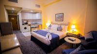 Green House Hotel Suites & Apartmentにあるベッド