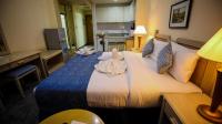 Green House Hotel Suites & Apartmentにあるベッド