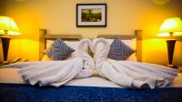 Green House Hotel Suites & Apartmentにあるベッド