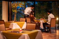 a group of people sitting at a table in a restaurant at Hotel Io Alpheratz in Kasama