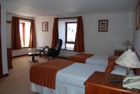 Postel nebo postele na pokoji v ubytování The Priory Hotel