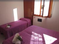A bed or beds in a room at Flat with large terrace to enjoy the sun