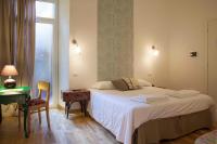 A bed or beds in a room at Albergo delle Spezie