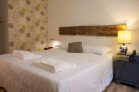 A bed or beds in a room at Albergo delle Spezie