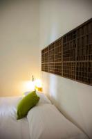 A bed or beds in a room at Albergo delle Spezie