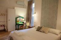 A bed or beds in a room at Albergo delle Spezie