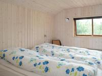 Postel nebo postele na pokoji v ubytování 8 person holiday home in Blåvand