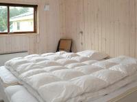 Postel nebo postele na pokoji v ubytování 8 person holiday home in Blåvand