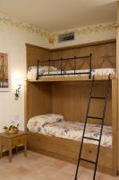 two bunk beds in a room with a ladder at Hotel Santa Maria in Rome