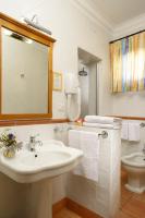 a bathroom with a sink and a toilet and a mirror at Hotel Santa Maria in Rome