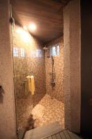 a bathroom with a shower with a glass door at Fanlin House in Jialin