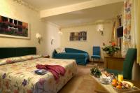 a hotel room with a bed and a couch at Hotel Santa Maria in Rome