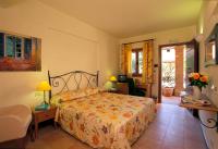a bedroom with a bed and a living room with at Hotel Santa Maria in Rome