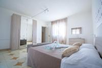 Posteľ alebo postele v izbe v ubytovaní VILLA SALINA MONACI